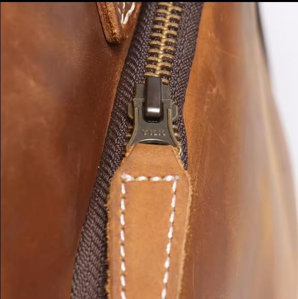 Mullis Mercantile Leather Weekender Travel Bag, a timeless classic. This vintage leather duffle bag is perfect for airline carry on, full-grain leather, a retro design, gym, and a YKK zipper in brown.